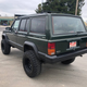 Image for article titled At $4,999, Does This Raised Up 1996 Jeep Cherokee Come With a Jacked Up Price?
